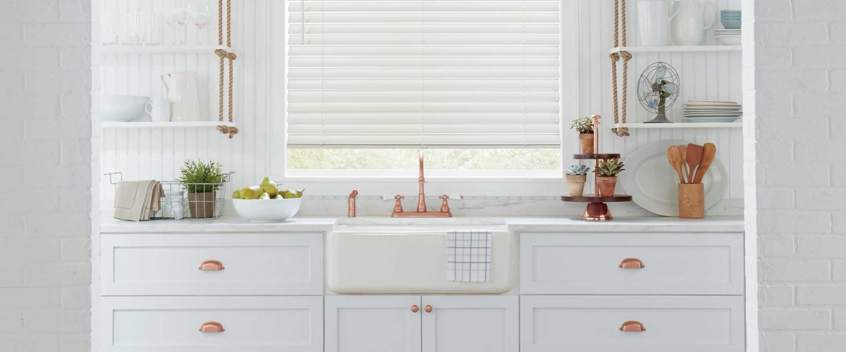White kitchen with copper hardware 